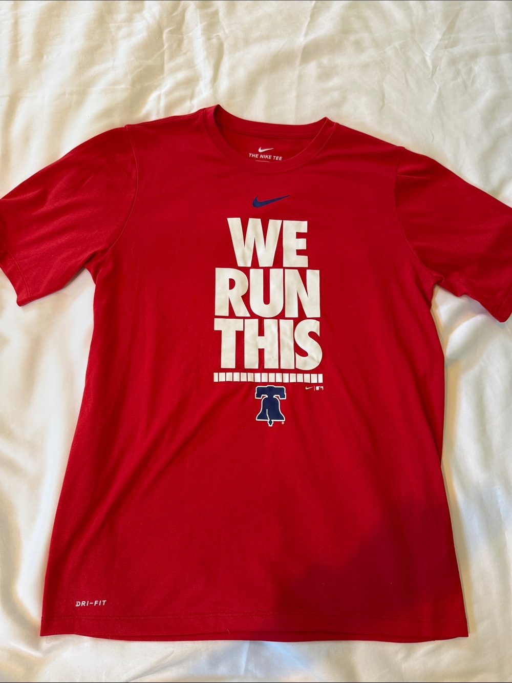 Nike Red Athletic Tee with White 'WE RUN THIS' Graphic